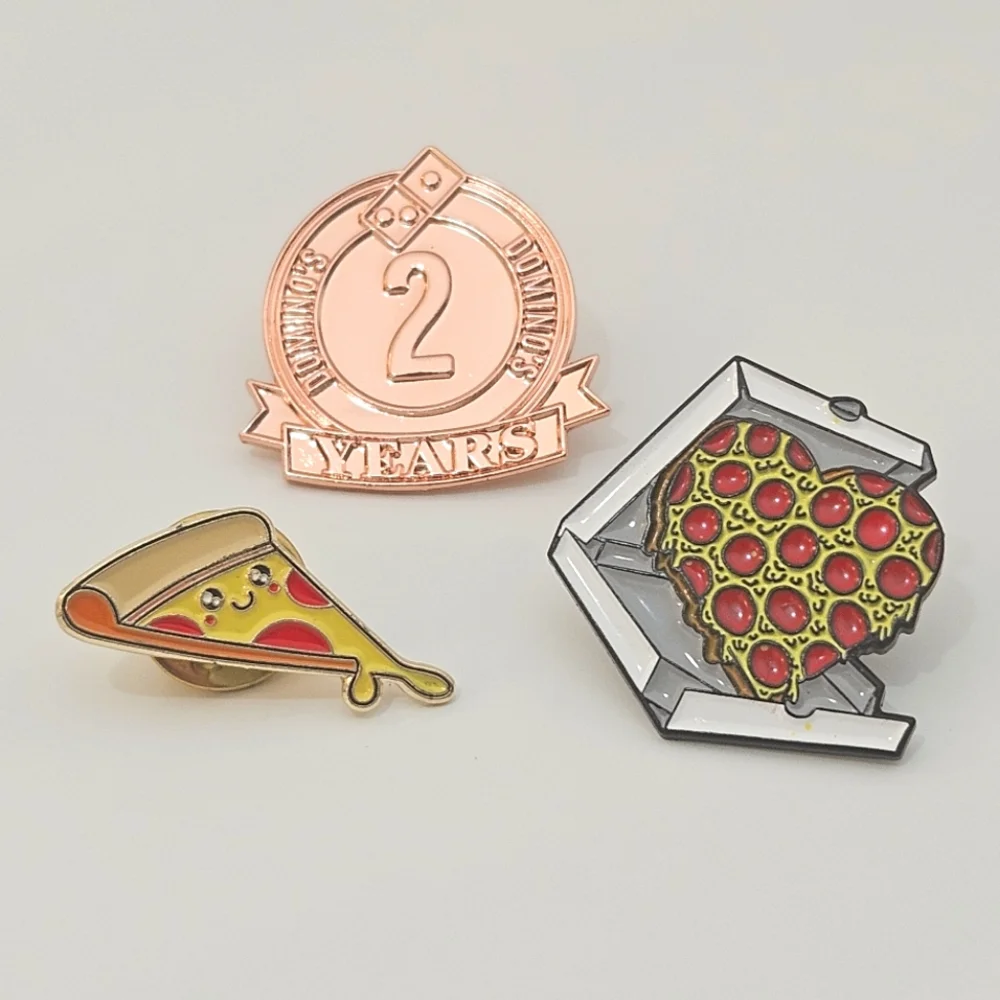 Domino's pizza pins, happy face pizza, heart-shaped pizza in box,and 2 yos pin